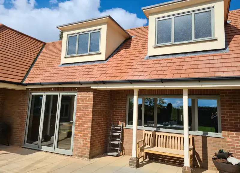 Aluminium bifold doors on a glazed extension supplied by Tradesupply Windows