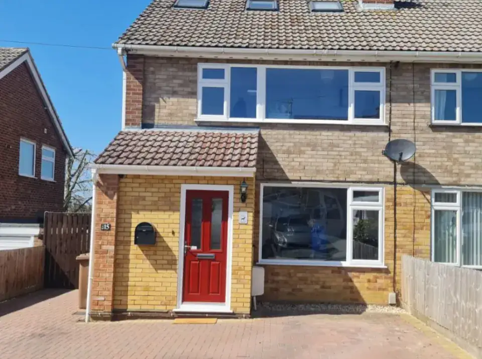 Canterbury style composite door with arched Georgian bar glazing supplied by Tradesupply Windows